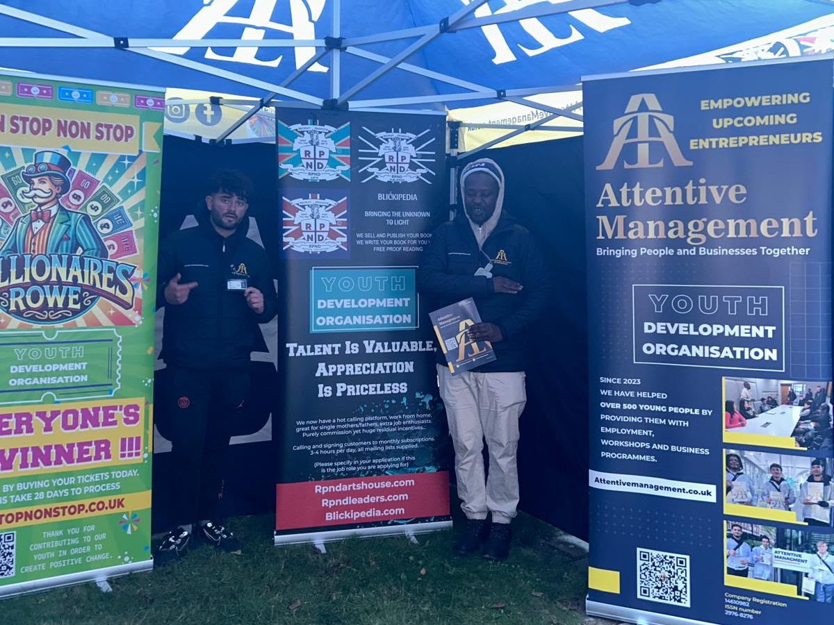 The RPND team at a community event stand, with Attentive Management, Non Stop Non Stop, Blickipedia and RPND banners